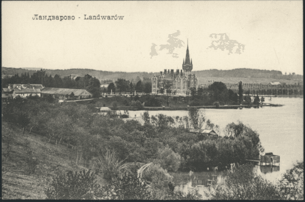 Black-and-white postcard showing a neo-Gothic palace with spire across a lake, wooded shore in foreground