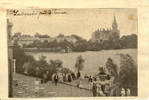 Early 20th-Century Resort Postcard Vintage postcard showing a lake, palace with spire, terrace with strolling visitors and tables