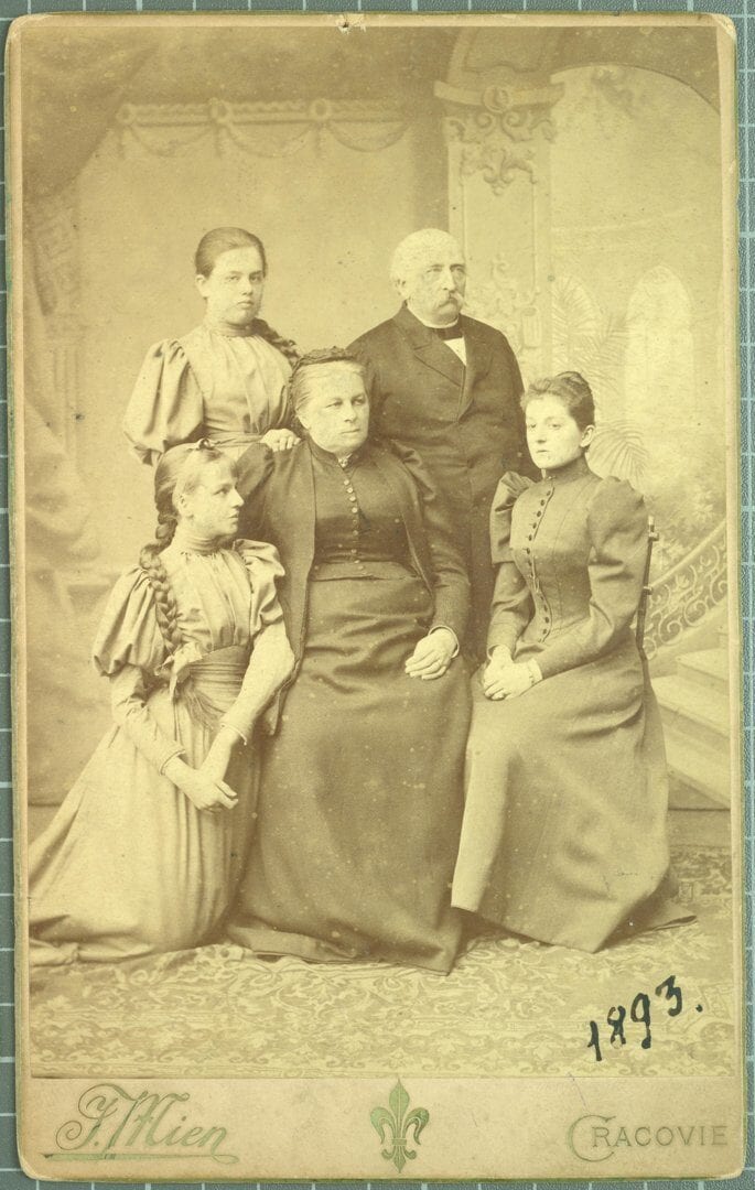 Noble Family Portrait, Krakow 1893 Sepia studio portrait on cabinet card of an elderly couple with three young women, dated 1893