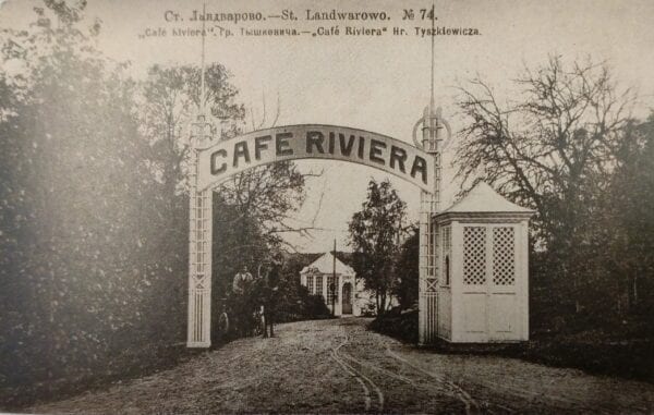 Cafe Riviera Entrance Gate Postcard Vintage postcard showing an ornate entrance arch reading Cafe Riviera with gatekeeper's hut and park path